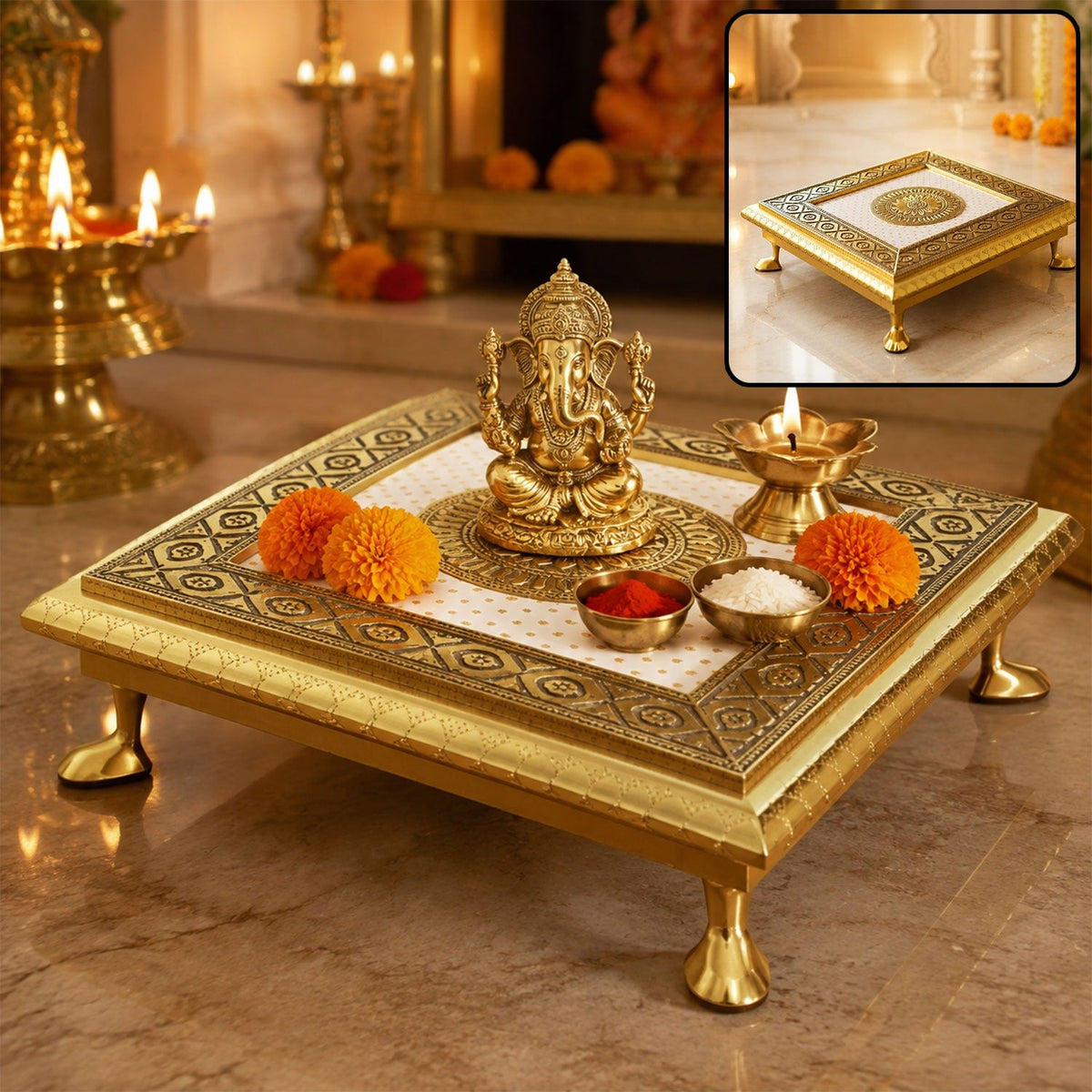 A golden square pooja chowki with a Ganesha idol, two orange flowers, and small bowls of kumkum and rice. A small inset